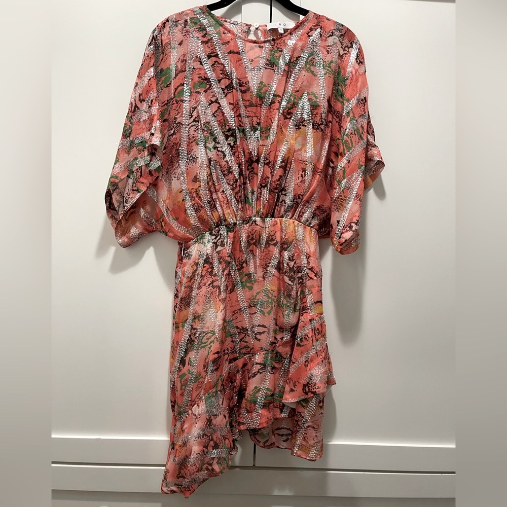 This dress is stunning and looks very sexy on. It’s more peach than pink.